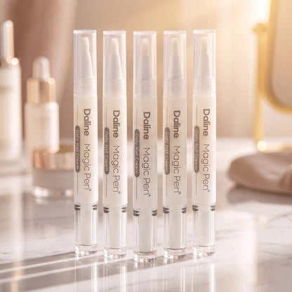 Five Daline Magic Pen nail cream applicators arranged in a row on a marble surface with a softly blurred vanity background.